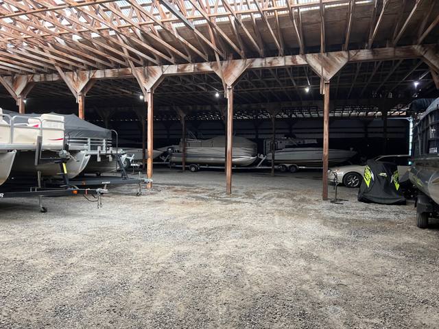 Pontoons and boats parked under the long covered roof